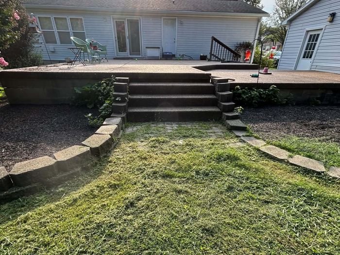Backyard patio area after trim and edge service