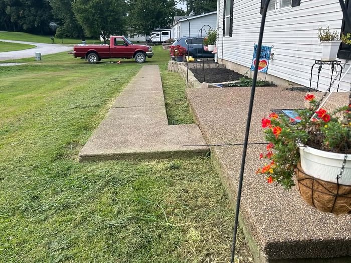 Walkway and flower beds after lawn care visit